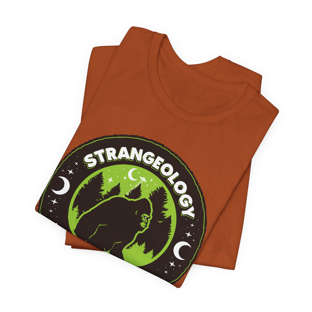 Strangeology Tee — "Exploring the Weird" Bigfoot Cryptid T-Shirt